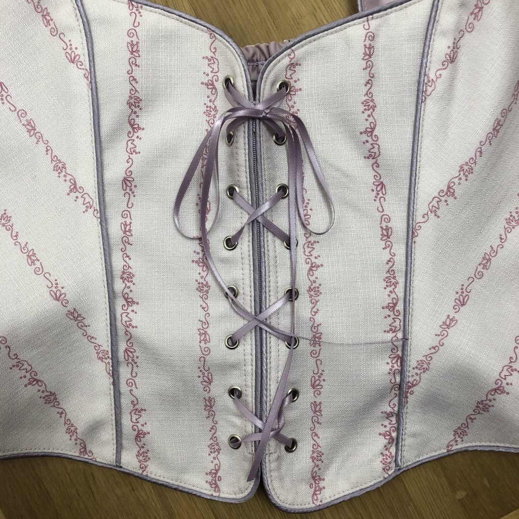 Lace up detail and piping Bodice